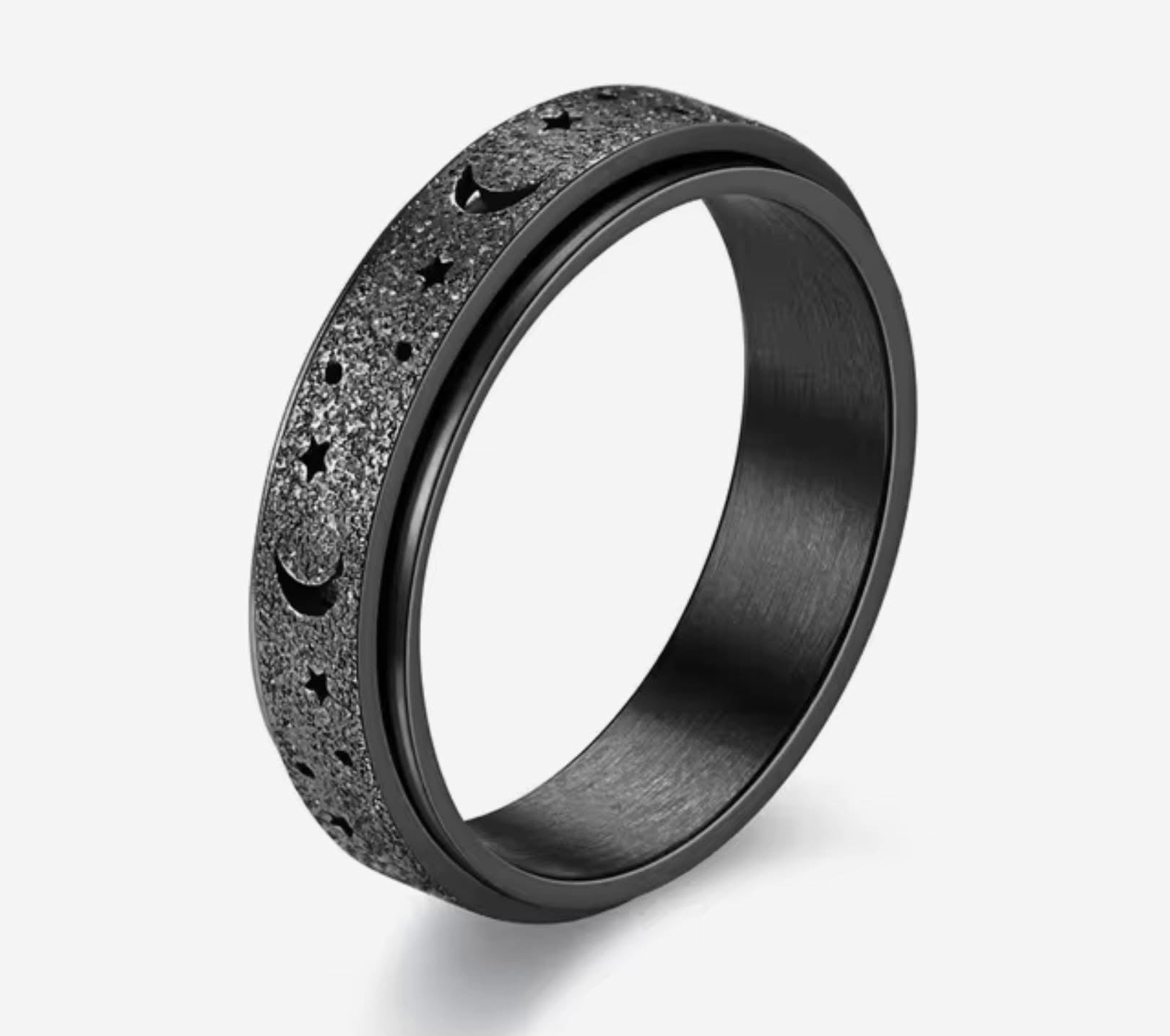 Bague spinner noir avec étoile et lune