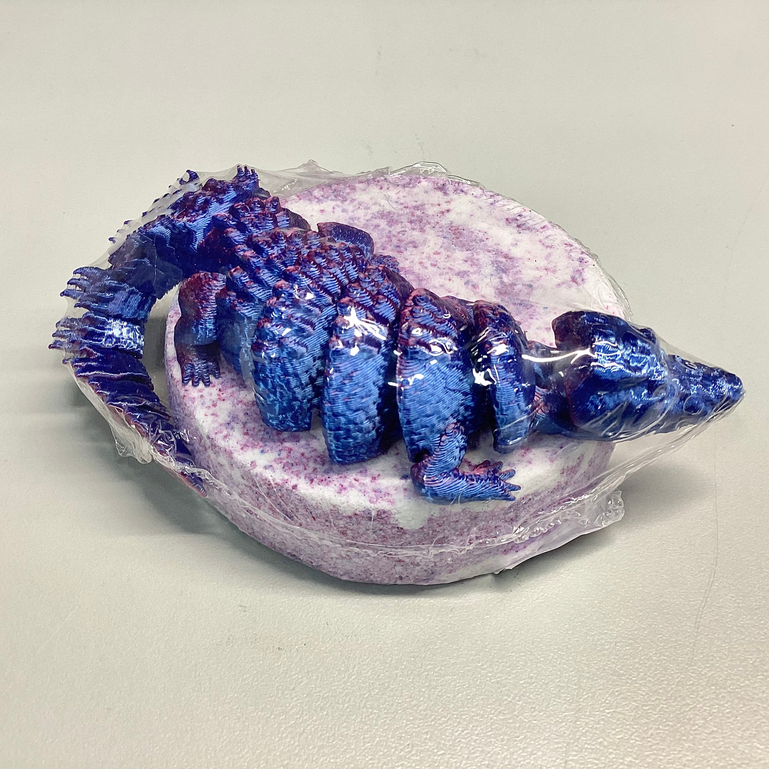 Bombe de bain avec jouet crocodile articulé