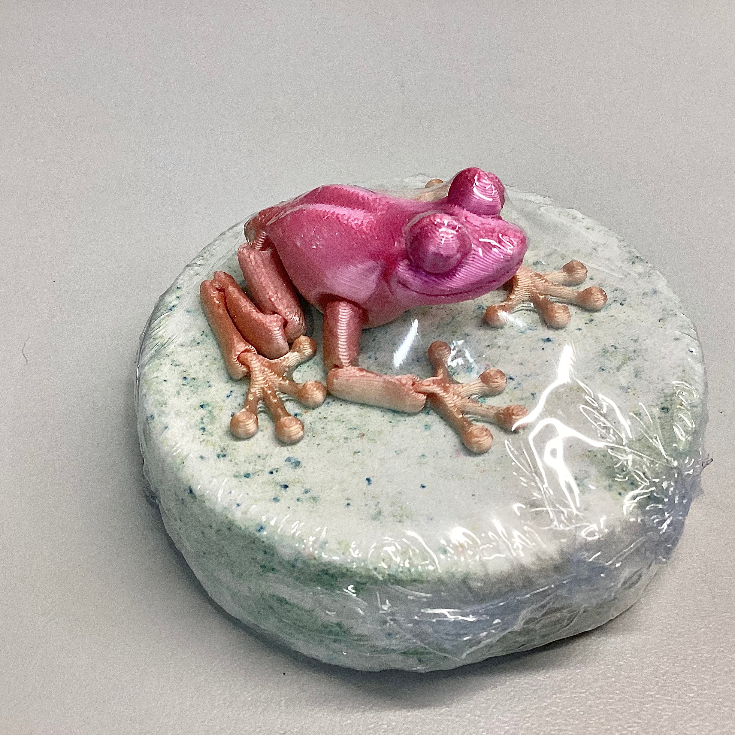 Bombe de bain avec jouet grenouille articulée