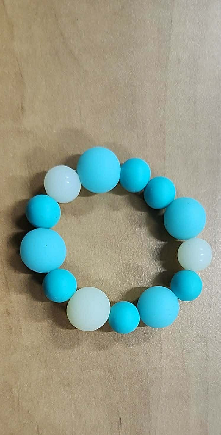Bracelet de dentition en silicone brille dans le noir